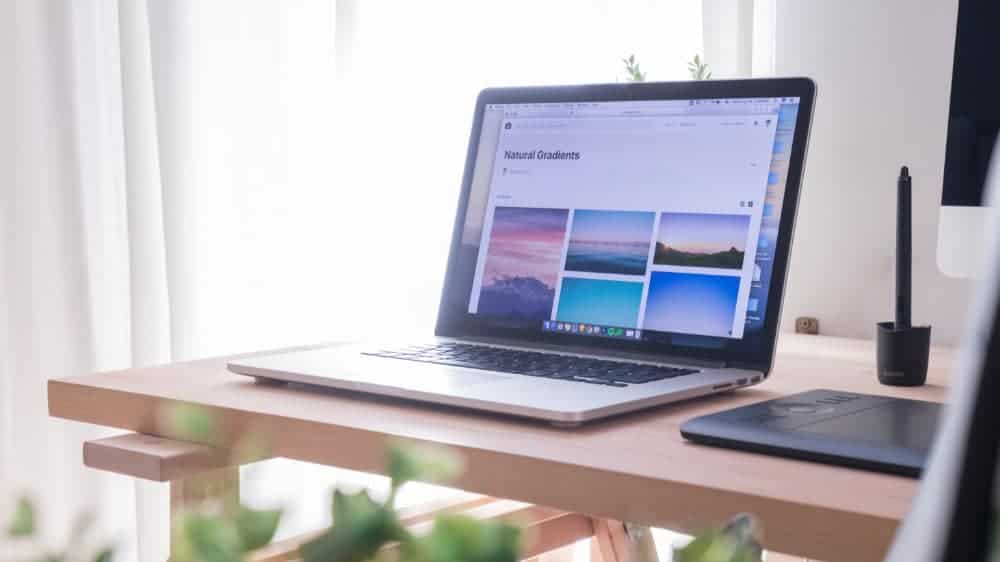 Laptop with opened screen stands on the desk